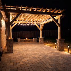 Garrisons Landscaping - This custom pergola + fire pit patio was built for one thing -- serious outdoor living.
Solid stone columns.
Professional base prep.