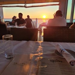 Lookout Lounge - dining room (2nd floor) opens up to perfect bayside waters with breeze and alluring sunset views during dinner. Spectacular and calm.