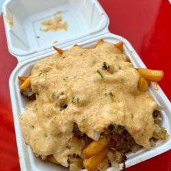 Loaded fries: cheeseburger over fries with grilled onions and house sauce