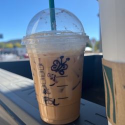 Starbucks - Pumpkin latte over ice with a butterfly to cheer me up ... compliments of the lovely barista!