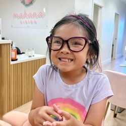 Makana Vision - My daughter trying on glasses.