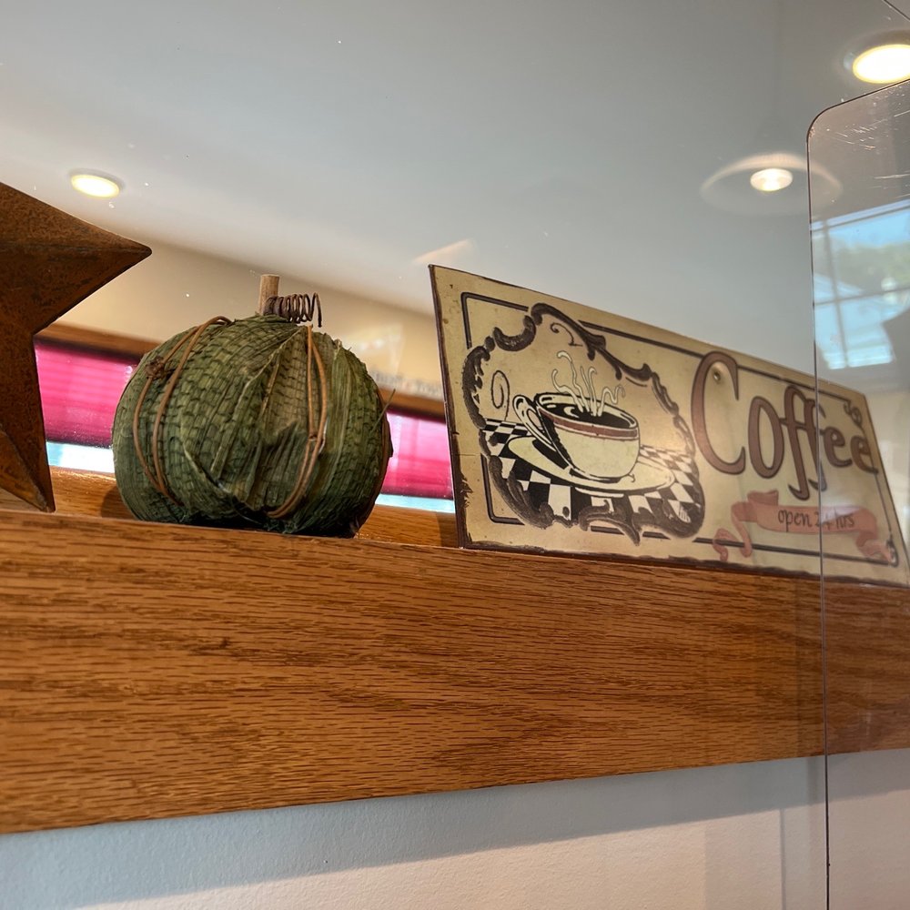 a pumpkin and a star on a shelf a pumpkin and a star on a shelf