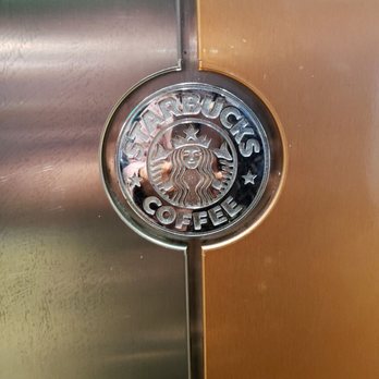 Starbucks - a starbucks logo on a metallic door - Coffee & Tea Near Me - Newmarket, Ontario Starbucks - a starbucks logo on a metallic door - Coffee & Tea Near Me - Newmarket, Ontario