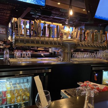 Chickie's & Pete's - Bar (in the center of the room) with tons of taps. - Seafood Near Me - Malvern, Pennsylvania Chickie's & Pete's - Bar (in the center of the room) with tons of taps. - Seafood Near Me - Malvern, Pennsylvania