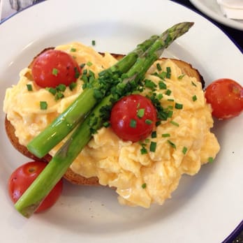 Daniel Son - Scrambled eggs topped with cherry tomatoes, asparagus and herbs. Trying to mess with the smashed avo fetish - Coffee & Tea Near Me - Murrumbeena, VIC