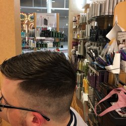 Regis Salon - Man cut low fade
