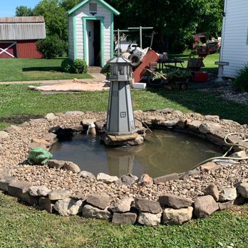 JC Landscaping And Roofing - An old tree stumped turned into a pond - Roofing Near Me JC Landscaping And Roofing - An old tree stumped turned into a pond - Roofing Near Me