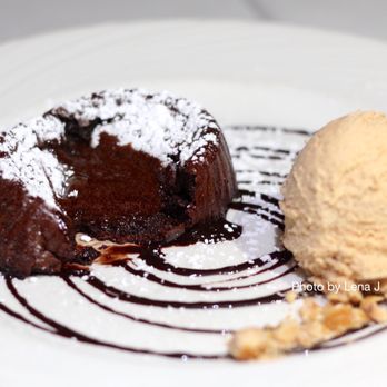 Piccolo Sogno - Inside of Tortino di Gianduja ($13) - warm hazelnut chocolate cake, hazelnut gelato. Cake is molten inside, quite sweet. - Italian Near Me - Chicago, Illinois Piccolo Sogno - Inside of Tortino di Gianduja ($13) - warm hazelnut chocolate cake, hazelnut gelato. Cake is molten inside, quite sweet. - Italian Near Me - Chicago, Illinois
