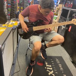 Murphy's Music - Nathan playing a bass guitar