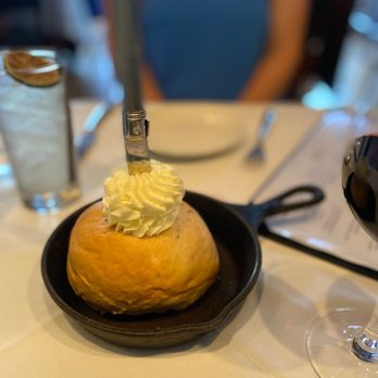 Cork & Cow - a plate of food and a glass of wine - Steakhouses Near Me - Franklin, Tennessee Cork & Cow - a plate of food and a glass of wine - Steakhouses Near Me - Franklin, Tennessee
