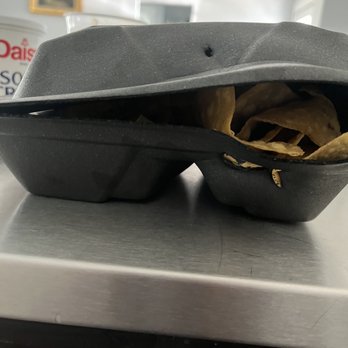 Cotton Patch Cafe - chips with no dip, melted to the Togo box - American Near Me - Waxahachie, Texas