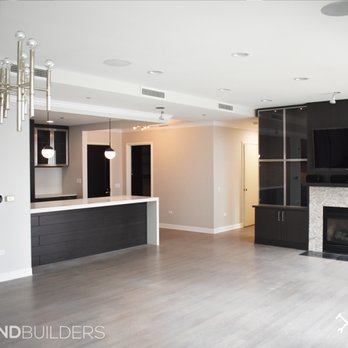 Legend Design Build - Interior Remodel: custom cabinets, in cabinet lighting, refinished wood floors, tile fireplace, installed media center, quartz counter tops - General Contractors Near Me - Indianapolis, Indiana