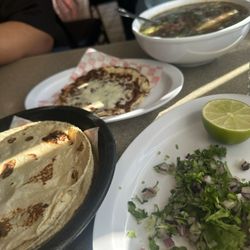 Las Plebes Tacos y Mariscos - Fresh tortillas and veggies for the caldo
