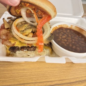 Nelson’s Burger Bar - The Nelson with sautéed mushrooms, bacon and blue cheese dressing added, and a side of baked beans - Burgers Near Me - Tallahassee, Florida Nelson’s Burger Bar - The Nelson with sautéed mushrooms, bacon and blue cheese dressing added, and a side of baked beans - Burgers Near Me - Tallahassee, Florida
