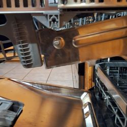 Appliance Care Polson - This clip is suppose to stay attached. Holding rack up. If it falls down the sprayer that turns underneath hits the bottom dishes, and stop