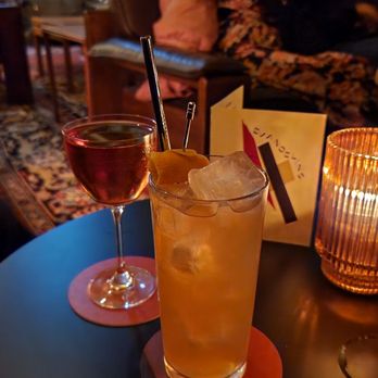 Evangeline - a glass of wine and a drink on a table - Cocktail Bars Near Me - Toronto, Ontario