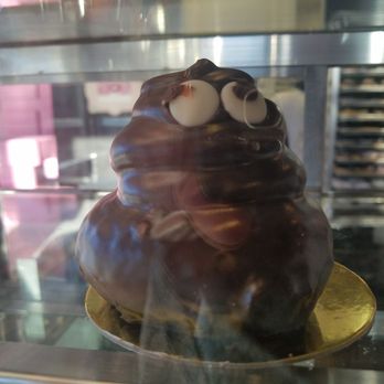 Pinkbox Doughnuts - Glass reflection riined the shot but meet Mr Poop donut! - Donuts Near Me - Henderson, Nevada Pinkbox Doughnuts - Glass reflection riined the shot but meet Mr Poop donut! - Donuts Near Me - Henderson, Nevada
