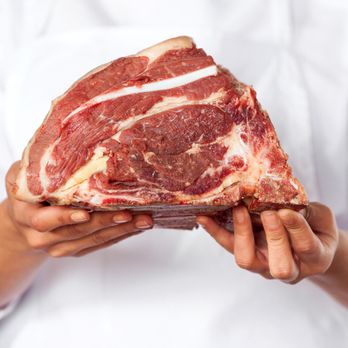 Sea Bend Meat - a person holding a piece of meat - Meat Shops Near Me - Shoreline, Washington Sea Bend Meat - a person holding a piece of meat - Meat Shops Near Me - Shoreline, Washington