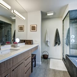 Artisan Kitchens & Renovations - This ensuite features a new steam shower in a modern look