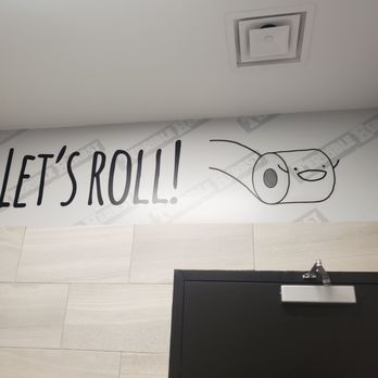Chevron - a toilet with a roll of toilet paper on the wall - Gas Stations Near Me - Las Vegas, Nevada
