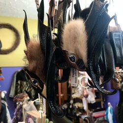 The Enchanted Forrest - We have these leather, handmade bats by local artist Lynn Lyndal. Very cool!