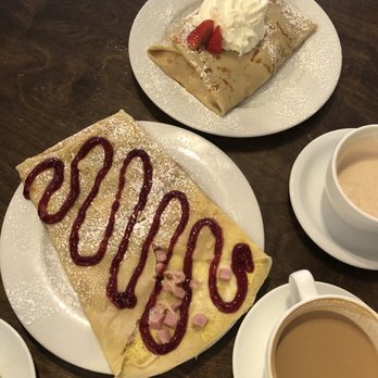 Cafe Javasti - Top - Fresh Strawberries , Vanilla Cream , And Whipped Cream Bottom - monte cristo w/ jam drizzle - Coffee & Tea Near Me - Seattle, Washington