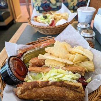 Dion's - a sandwich and chips on a table - Pizza Near Me - Albuquerque, New Mexico