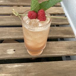 Little Riot Cocktail - Bourbon, Cognac, Raspberry Oleo Saccharium, Black Walnut Bitters, Champagne Little Riot Cocktail - Bourbon, Cognac, Raspberry Oleo Saccharium, Black Walnut Bitters, Champagne
