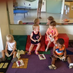 The toddler "book club" meets everyday. Sharing books helps toddlers develop language and communication skills.