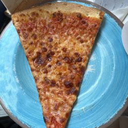 Slice of Traditional Large pizza. Slice of Traditional Large pizza.