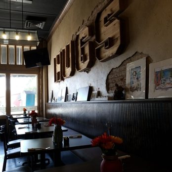 Hugs Cafe - Entrance with their Hugs sign on the inside. - Salad Near Me - McKinney, Texas