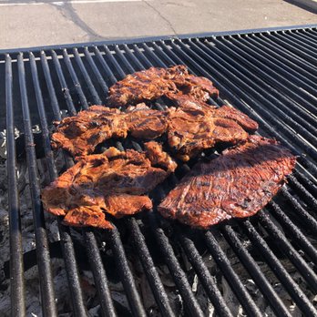 Rancheros Carniceria - Carne Asada steaks cooking on the grill. - Butcher Near Me - Tucson, Arizona Rancheros Carniceria - Carne Asada steaks cooking on the grill. - Butcher Near Me - Tucson, Arizona