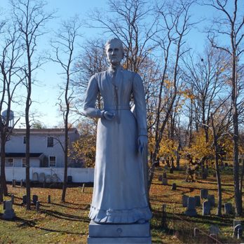 Lakeview Cemeteries - A white bronze statue of Ruth Newey Smith that was designed in her likeness. - Landmarks & Historical Buildings Near Me - Patchogue, New York