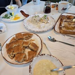 Tasty gravy biscuits, grits, applewood bacon and sunny side up eggs! Tasty gravy biscuits, grits, applewood bacon and sunny side up eggs!