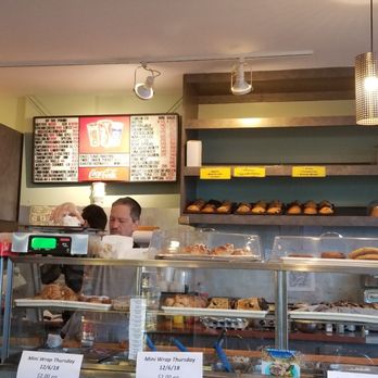 Bagel Town - a man and a woman in a bakery - Bagels Near Me - West Hempstead, New York