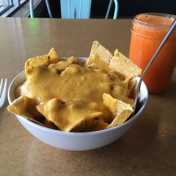 Real Roots Cafe - Nacho's with chili   Carrot, Pineapple, Orange, Ginger Juice - Cafes Near Me - Chattanooga, Tennessee