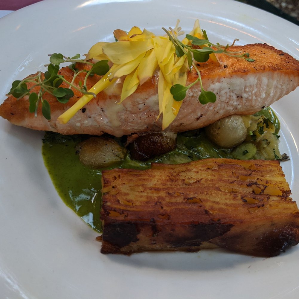 Bistro Campagne - Salmon with fava beans pearl onions potato, chili oil and chervil cream - French Near Me - Chicago, Illinois Bistro Campagne - Salmon with fava beans pearl onions potato, chili oil and chervil cream - French Near Me - Chicago, Illinois