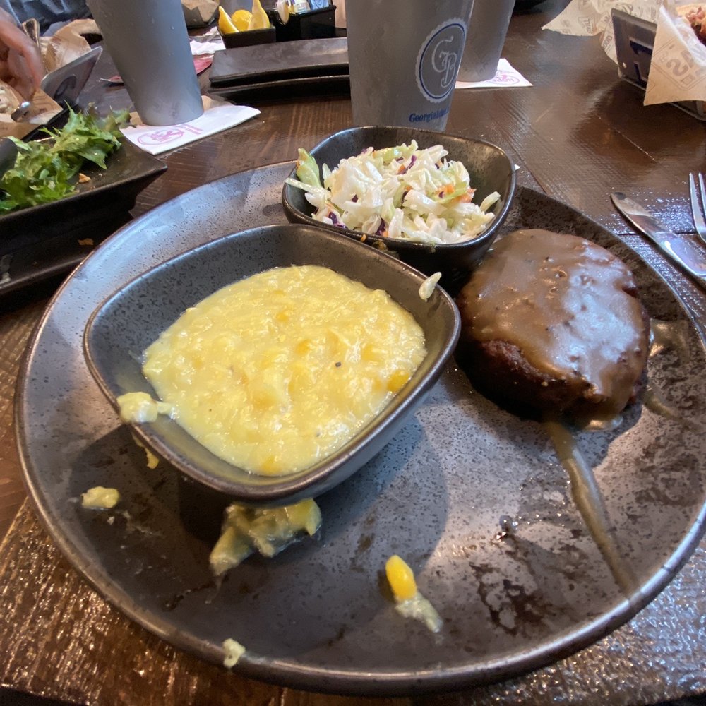 Georgia Blue - Messy blue plate of dry hamburger steak. - Southern Near Me - Madison, Mississippi