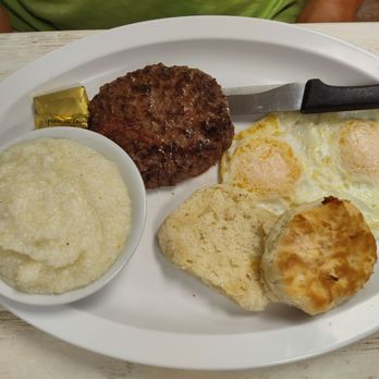 Debra's Place - Two eggs with a hamburger patty, grits and biscuit - New American Near Me - North Palm Beach, Florida Debra's Place - Two eggs with a hamburger patty, grits and biscuit - New American Near Me - North Palm Beach, Florida