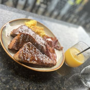 Curio Bistro - French Toast & Eggs with orange juice - Cajun/Creole Near Me - New Orleans, Louisiana