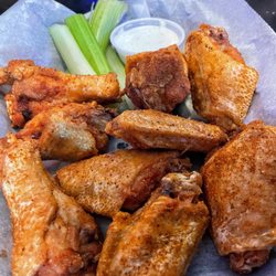 Club 400 Bar and Grill - Bone-in wings, tossed in the secret off-menu Old Bay dry rub.
