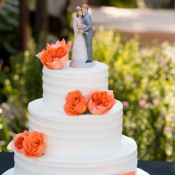 Hans & Harry's Bakery - 3-tiered wedding cake with real flowers. Decorated by Hans & Harry staff. - Bakeries Near Me - Bonita, California Hans & Harry's Bakery - 3-tiered wedding cake with real flowers. Decorated by Hans & Harry staff. - Bakeries Near Me - Bonita, California