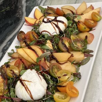 Chef Joslin - Heirloom tomato and seasonal stone fruit and burrata basil oil aged balsamic and micro greens salad - Personal Chefs Near Me