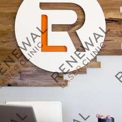 Renewal Laser Clinic - Logo behind reception desk #renewallaser #tattooremovalmn