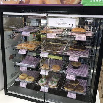7-Eleven - a display case of doughnuts - Convenience Stores Near Me - Novi, Michigan