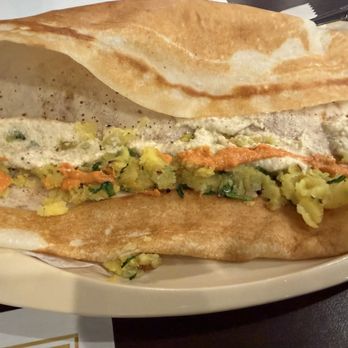 5th Element Indian Bistro & Bar - Open the dosa to spread the spiced potatoes and add the coconut chutney and some hot sauce. - Indian Near Me - Delray Beach, Florida