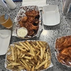 Hat Trix Bar and Grill - Philly cheesesteak with delicious Mac salad, kickin bourbon wings, fries, and hot wings