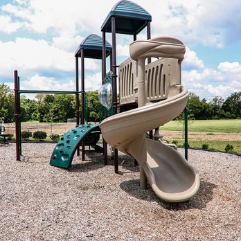 Happy Backyards - Detailed view of a spiral slide on a commercial playground. - Kids Activities Near Me - Collierville, Tennessee Happy Backyards - Detailed view of a spiral slide on a commercial playground. - Kids Activities Near Me - Collierville, Tennessee
