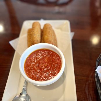 Antonio's Flying Pizza - a bowl of tomato sauce and two breadsticks - Italian Near Me - Houston, Texas