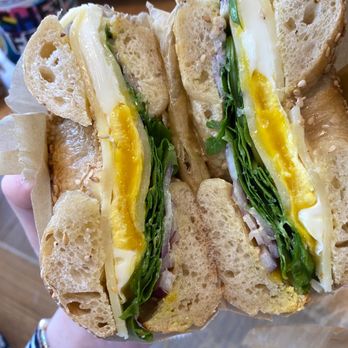 Bagelsaurus - Classic Jumbo Sandwich with arugula on sesame - Bagels Near Me - Cambridge, Massachusetts Bagelsaurus - Classic Jumbo Sandwich with arugula on sesame - Bagels Near Me - Cambridge, Massachusetts